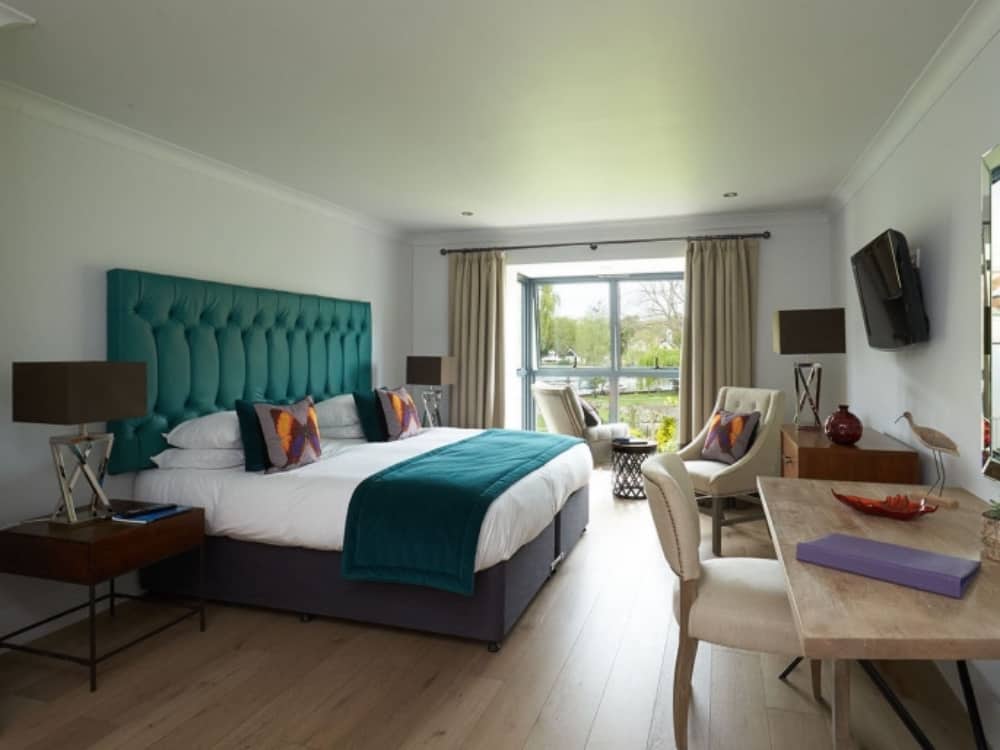 The Swan at Streatley riverside boutique hotel berkshire modern bedrooms with teal button back headboard