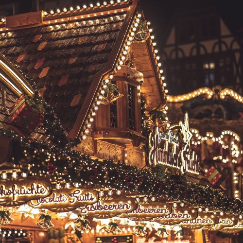 Christmas market stalls with lights