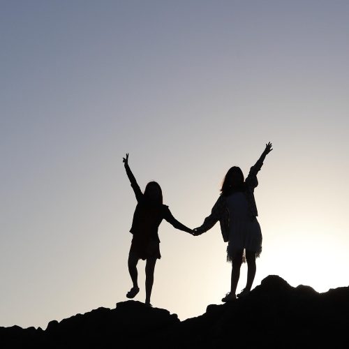 February half term in Cheshire. Children holding the hands up on a hill