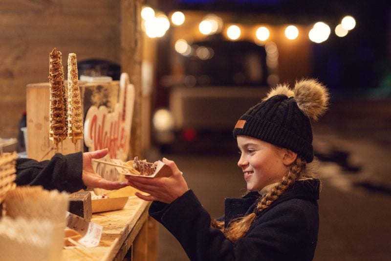 Ashridge house illuminated girl at food hut