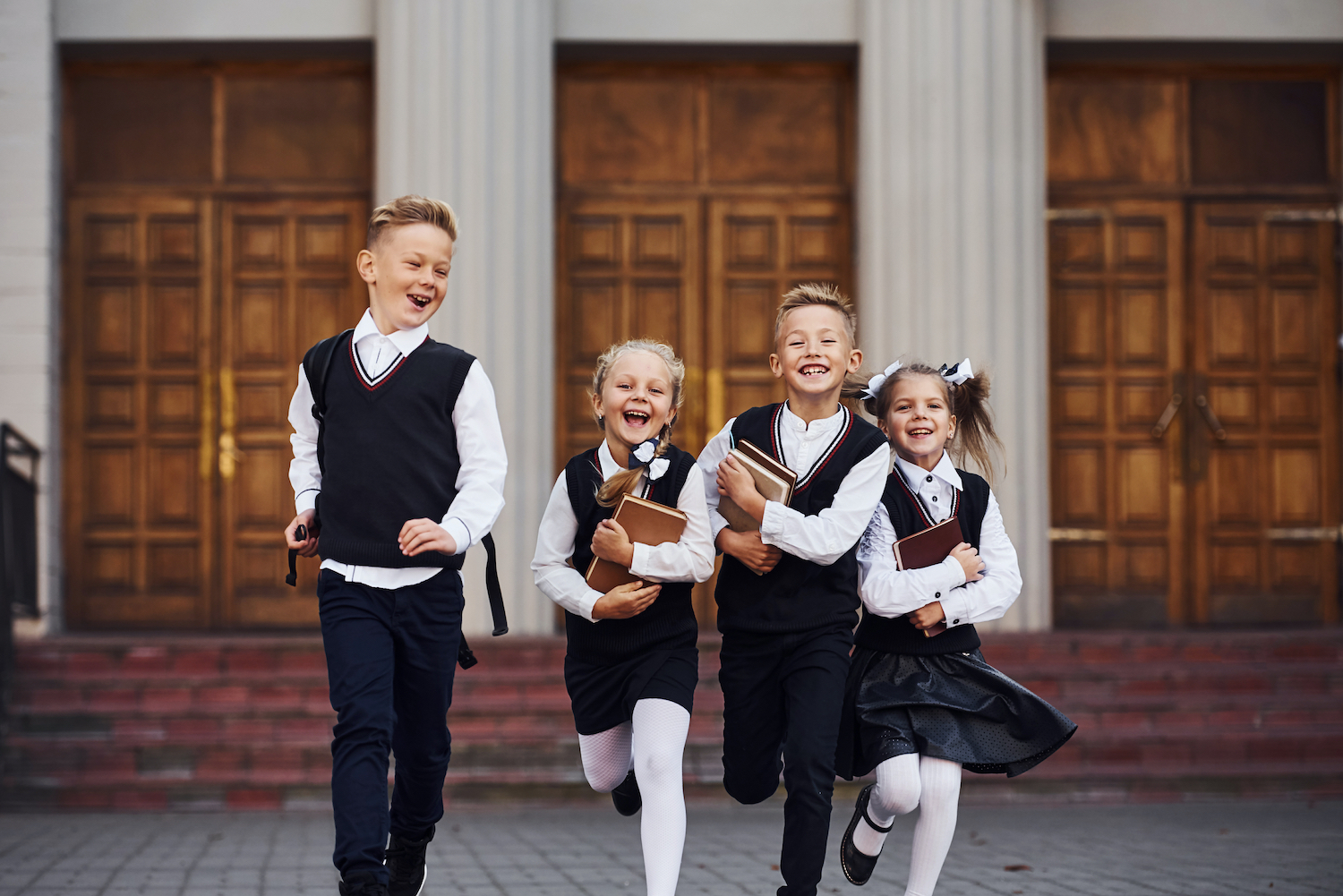 school children laughing running
