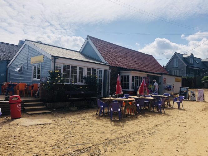 Past the higgedly piggedly coloured beach huts and to our first ...