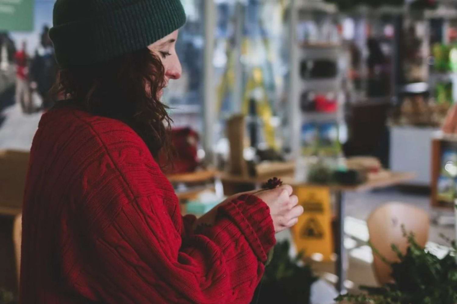 woman making christmas wreath