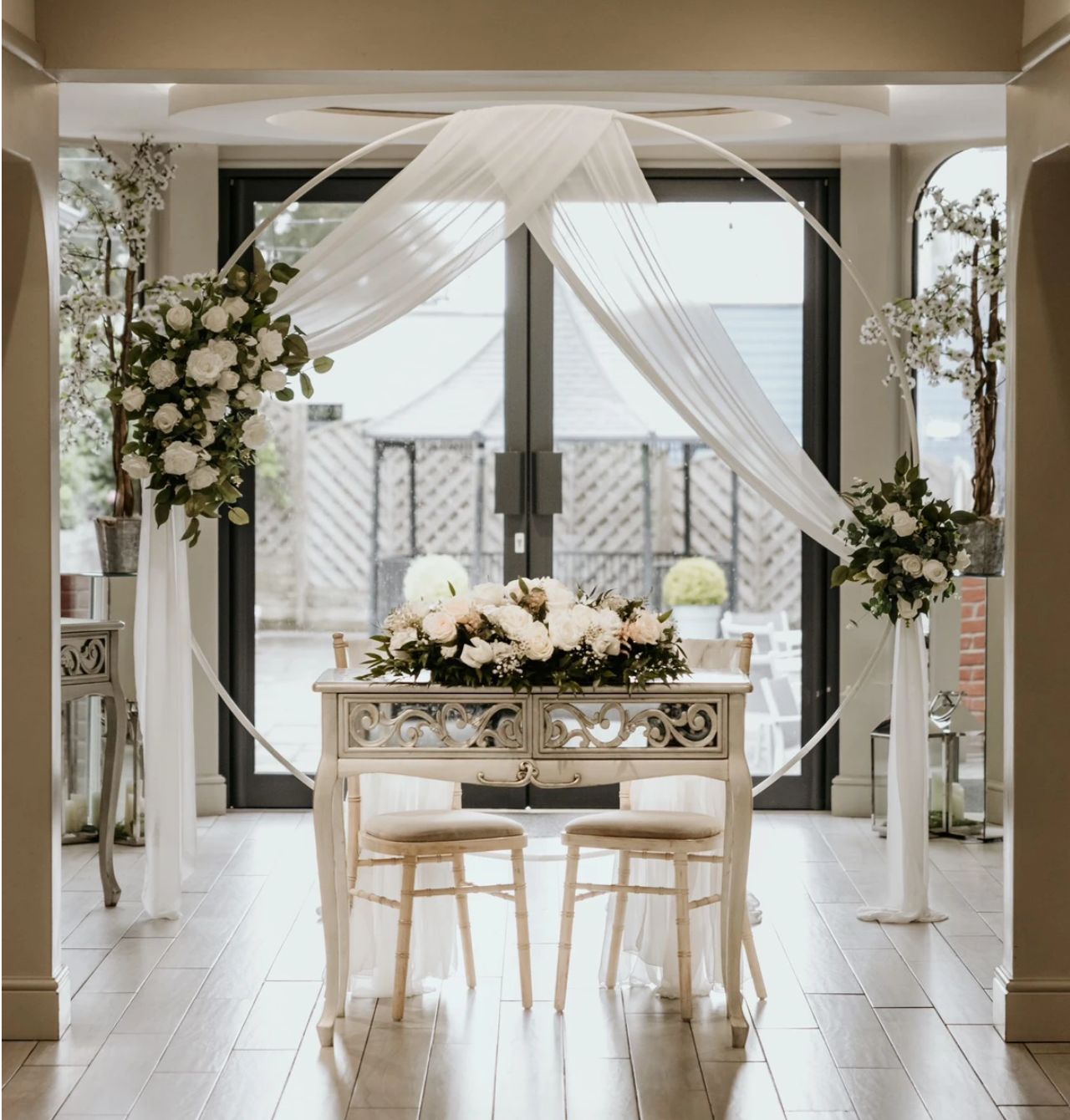 wedding ceremony styling with pretty drapes and flowers