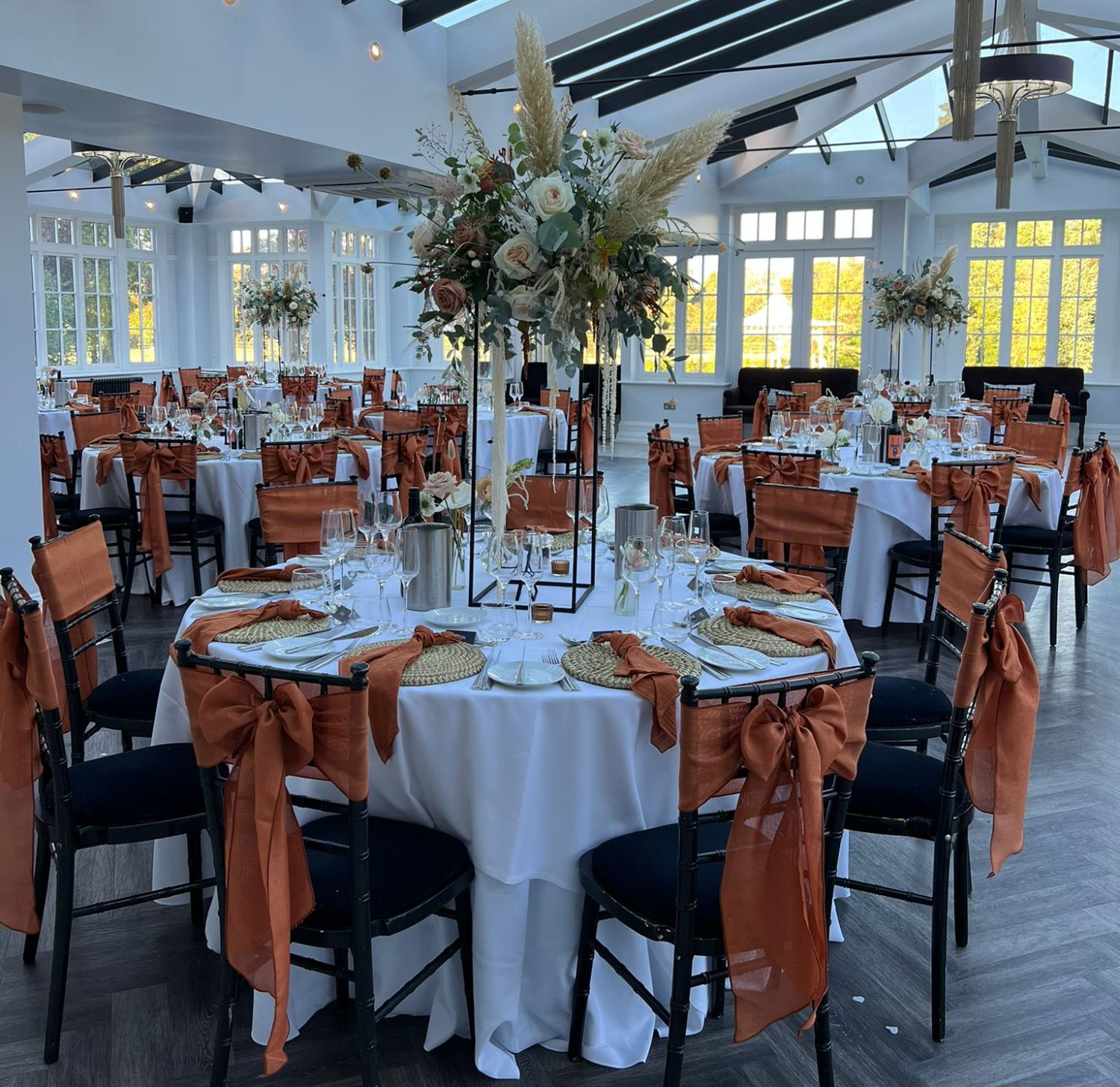 wedding reception set up with orange and black details