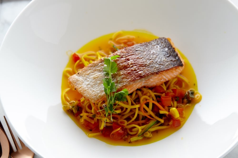 Pan-fried sea trout with chilli and saffron broth