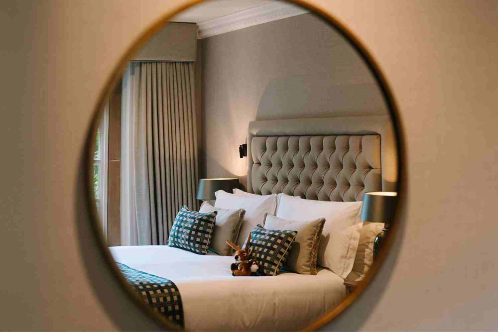 Pennyhill Park Hotel Bagshot Surrey bedroom reflection in mirror
